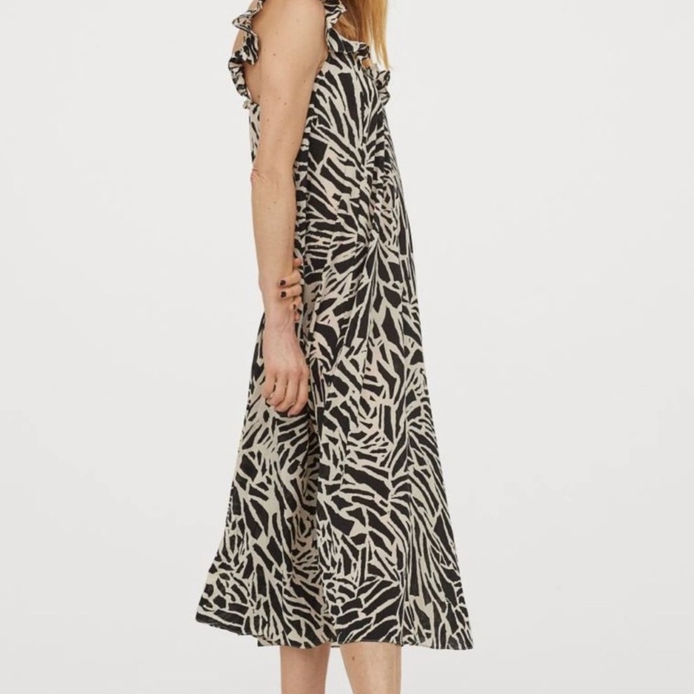 H & M ruffle trimmed dress in black and cream animal print